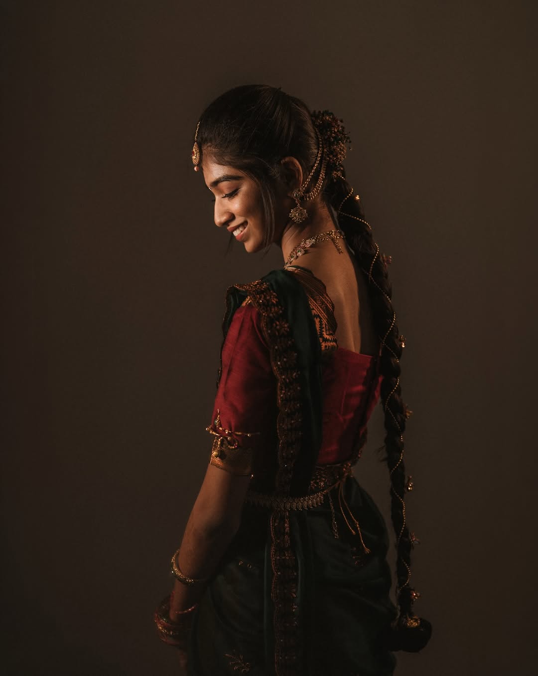 Bride in soft, low light. Memory Portraits By Nandhu