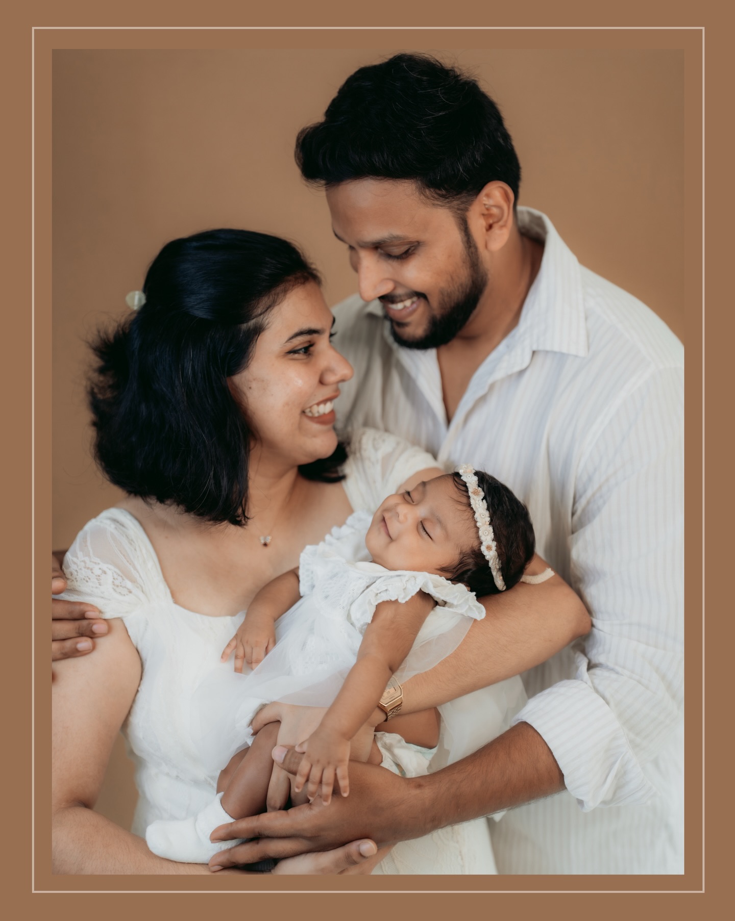 Mother and father with their newborn daughter