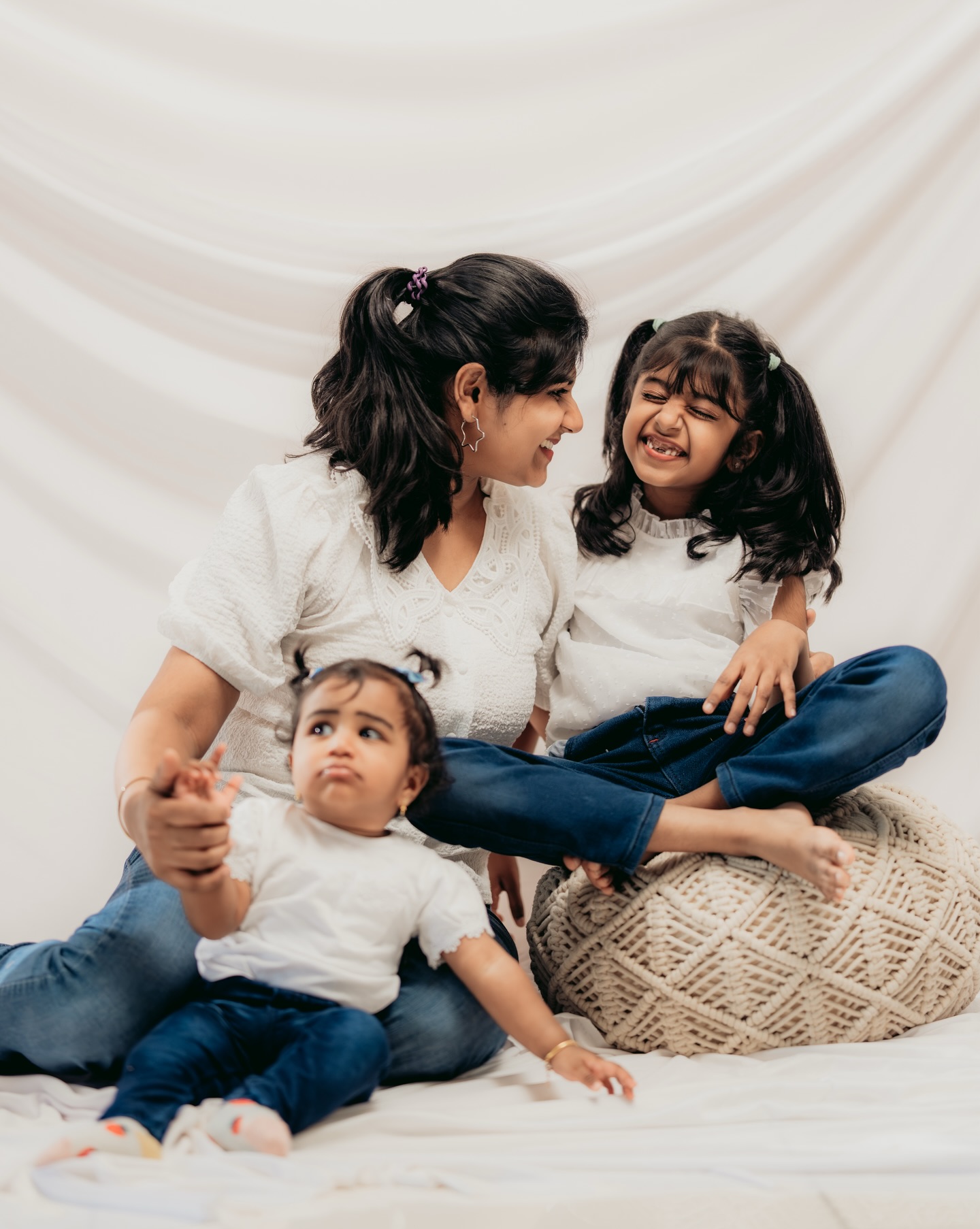 Mother with her two children on the studio floor